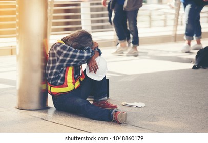 The Tired Engineer Sat On The Train Station.