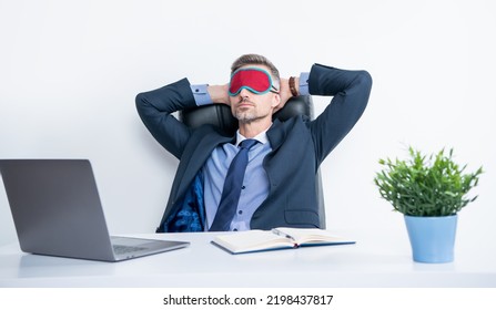 Tired Entrepreneur Relax In Sleep Mask At Workplace