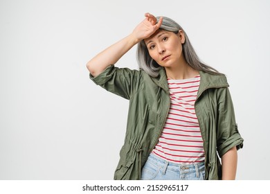 Tired exhausted frustrated caucasian mature middle-aged woman feeling overworked in casual clothes isolated in white background. Depression, migraine, menopause, climax, mental problems disorders - Powered by Shutterstock