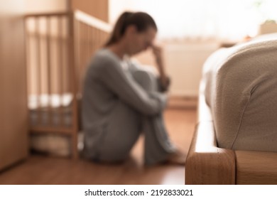 Tired, Exhausted, Mother, Wife At Home Sitting On Bedroom Floor. 