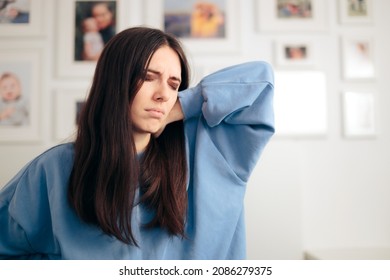 
Tired Exhausted Woman Suffering From Neck Pai. Young Person Rubbing Upper Back Feeling Discomfort And Hurt
