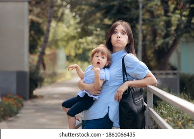 Tired Exhausting Mom Holding Naughty Toddler Child. Mother Feeling Overwhelmed  While Her Daughter Is Disobedient
