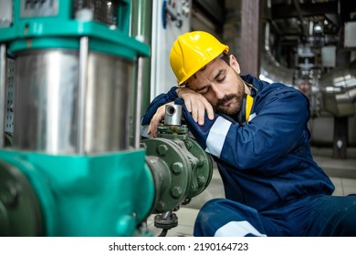 Tired Factory Worker Sleeping At Work During Night Shift.