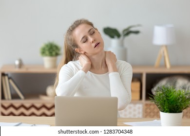 Tired fatigued young woman massaging stiff neck rubbing tensed muscles hurt to relieve back joint shoulder fibromyalgia pain after long sedentary computer work study in incorrect posture concept