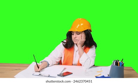 Tired female designer working with drawing on the chroma key - Powered by Shutterstock