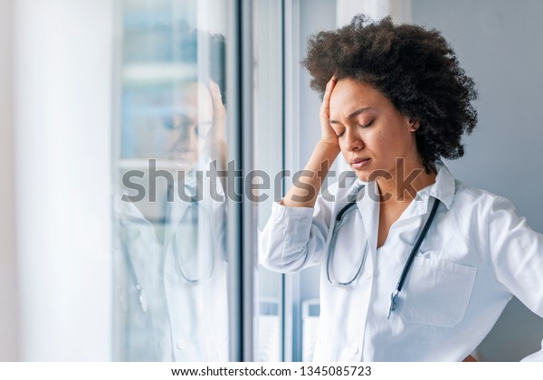 Tired Female Doctor Near Window Hospital Stock Photo (Edit ...