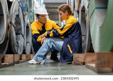 tired female worker feeling sick after stressed work in manufacturing factory, exhausted woman technician has problem working overload, male foreman support consoling and encorage at metal warehouse - Powered by Shutterstock