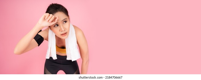 Tired Fitness Girl Get Exhausted And Fatigue After Exercise And Wiping Sweat Sport Woman Bend Down And Hands On Knees With Tired Pretty Young Asian Woman Taking A Break After Running Isolated On Pink 