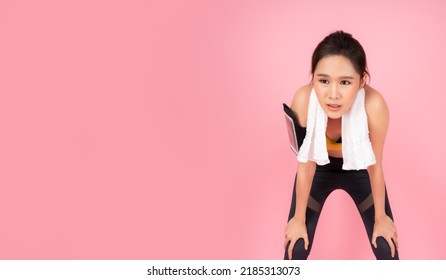 Tired Fitness Girl Get Exhausted And Fatigue After Exercise Or Workout Sport Woman Bend Down And Hands On Knees With Disheartened Pretty Young Asian Woman Take A Break After Running Isolated On Pink 