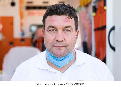 Tired Frontline Worker With Protective Suit During COVID-19