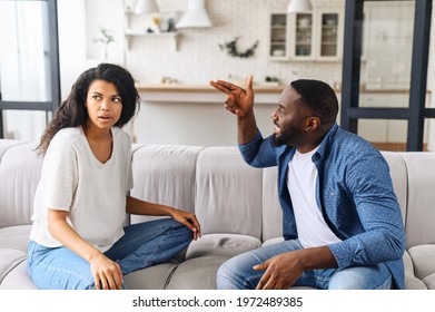 Tired Frustrated African Wife Ignoring Angry Black Despot Husband Arguing Blaming Upset Woman Of Problems, Jealous Man Shouting At Sad Girlfriend, Family Fight And Controlling Boyfriend, Disrespect