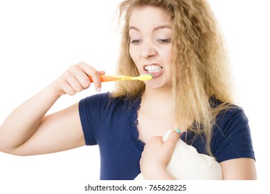 Tired Grumpy And Sleepy Blonde Woman Brushing Teeth Having Crazy Tangled Hair. Oral Hygiene Concept, Isolated Background.