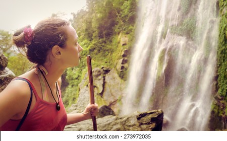 A Tired But Happy Young Tourist Woman Looking At The Waterfall In The Central America Jungles
Ecotourism Concept Image Travel Girl