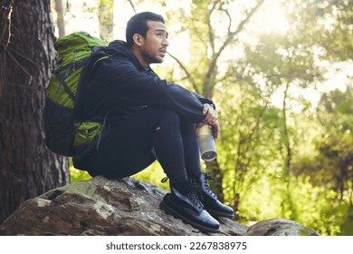 Tired, hiking or water bottle in woods, nature forest or fitness environment for relax, electrolytes or Japanese healthcare. Hiker man, backpacker or sports drink in rest, recovery or fatigue break - Powered by Shutterstock