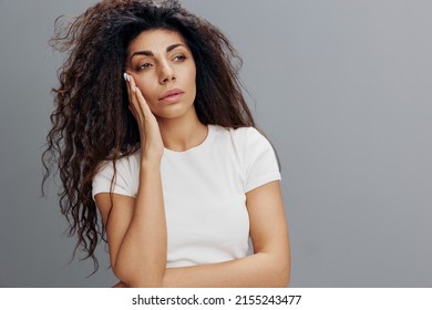 Tired Latin Afro-haired Woman Lady 20s 30s Years Old Wearing White Casual T-shirt Standing Put Hand On Head Having Headache Looking Aside Isolated On Gray Color Background Studio Portrait Copy Space