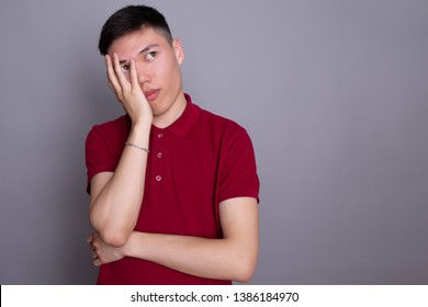 Tired Man. Closeup Portrait Of A Groggy Upset Worried Sad, Depressed Guy With A Headache Isolated On Gray Background. Negative Human Emotion Face Expression Reaction