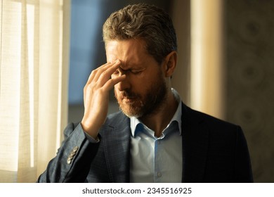 Tired man feel pain head. Close up portrait of stressed man suffer from headache at office. Stressed job. Painful man got migraine touches her head because of pain. Stressed, tired man from headache. - Powered by Shutterstock