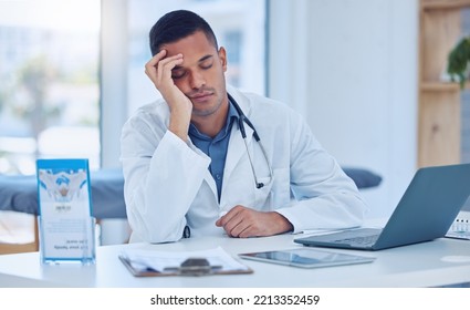 Tired Man In Medical Hospital, Doctor Napping At Office Desk And Healthcare Burnout In India. Exhausted Stress Nap From Insomnia, Sleeping Male By Laptop Desk And Mental Health In Doctors Clinic