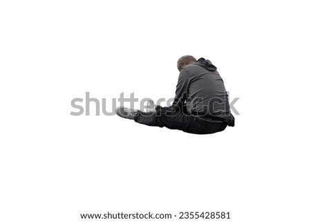 A tired man sits isolated on a white background.