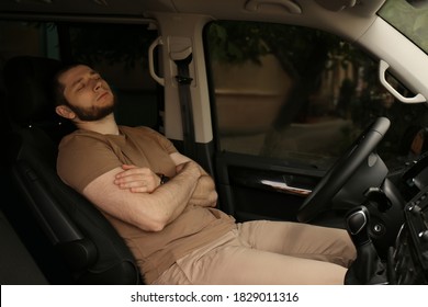 Tired Man Sleeping In His Modern Car