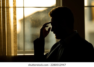 Tired man suffering from headache, touching head, relieving pain, migraine. Business problems. Bankruptcy, financial problem and crisis concept. Millennial hispanic man having headache. Migraine - Shutterstock ID 2280512947