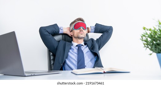 Tired Manager Relax In Sleep Mask At Workplace