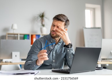 Tired Mature Man Feeling Pain Eye Strain, Rubbing Dry Irritated Eyes, Fatigued From Computer Work, Suffering From Headache, Bad Vision Sight Problem Sitting In Office