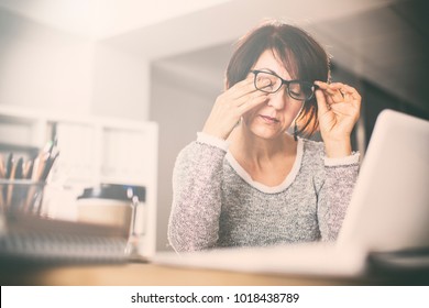 Tired Middle Age Woman Rubbing Eyes 