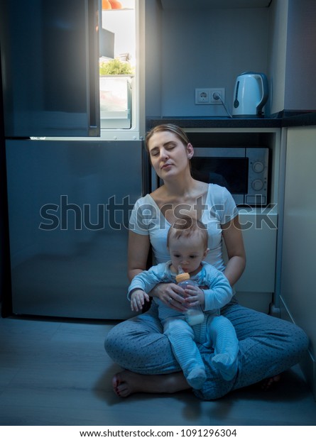 Tired Mother Sleeping On Kitchen Floor Stock Photo Edit Now