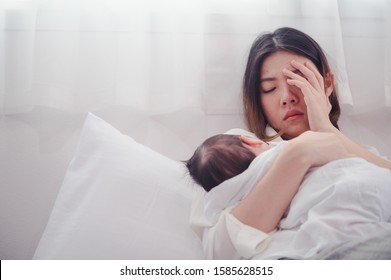 Tired Mother Suffering from experiencing postnatal depression.Health care single mom motherhood stressful.