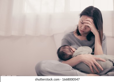 Tired Mother Suffering from experiencing postnatal depression.Health care single mom motherhood stressful. - Shutterstock ID 1668000547