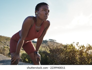 Tired, motivation and black woman running in nature, training exercise and fitness idea in Morocco. Breathing, relax and African runner thinking of a mountain workout, sports and cardio start - Powered by Shutterstock