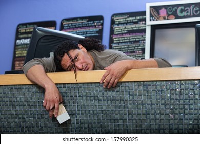 Tired Native American Restaurant Owner At Counter