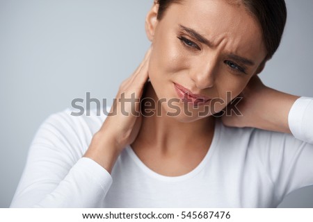 Tired Neck. Beautiful Young Woman Suffering From Neck Pain. Attractive Female Feeling Tired, Exhausted, Stressed. Girl Massaging Painful Neck With Hand. Body And Health Care Concept. High Resolution