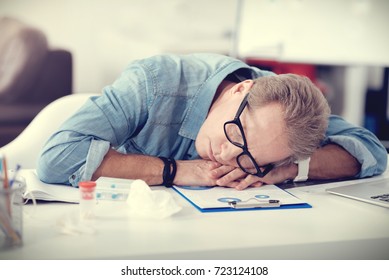 Tired Nice Man Sleeping At His Workplace