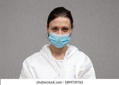 Tired Nurse With Marks On Her Face From A Medical Glasses. Coronavirus Covid-19 Outbreak. Overworked Health Workers. Doctor In Protective Suit With Madical Mask.