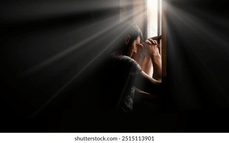 Tired pensive devote belief navy force young guy hero face cry hope hand pain love dark black old retro home room sun light text space Worry human feel lost despair frown upset warfare believe concept - Powered by Shutterstock