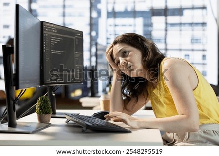 Tired programmer falling asleep while conducting tests to optimize machine learning models for performance and accuracy. Exhausted IT expert struggling to stay awake in office while analyzing data