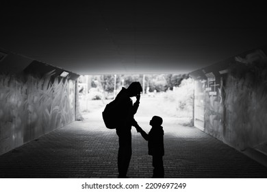 Tired , Sad, Stressed Single Father Parent Taking Care Of Child Standing In A Dark City Street. Family Hardship, Problems 