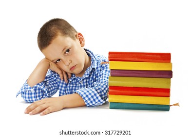 Tired Schoolboy With Learning Difficulties. Isolated On White Background