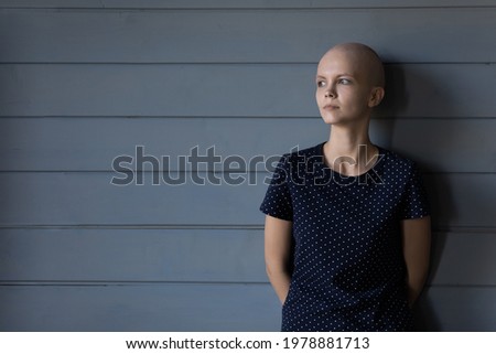 Tired serious cancer patient thinking of painful treatment, chemotherapy, negative prognosis. Thoughtful hairless woman, looking at copy space away. Oncology disease concept. Head shot portrait