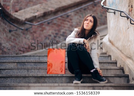 Tired Shopping Woman with Sore Feet Resting on Stairs. Shopaholic girl feeling exhausting after shopping spree
