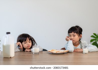 Tired Sibling girls fell asleep at breakfast - Powered by Shutterstock