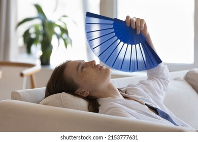 Tired Sick Millennial Girl Suffering From Heat, Hypoxia At Home Without Conditioner, Using Paper Fan, Blowing Cool Air Hot Air, Feeling Unwell Due To Summer Weather, Humidity, High Air Temperature