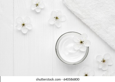 Tired skin cosmetic cream facial skincare medical treatment therapy, anti aging hydrate dermatology professional cleanser moisturizer natural hygiene product with flowers and towel on white background
