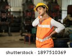 Tired stress women worker neck pain working in heavy industry factory, health problem asian labor concept.