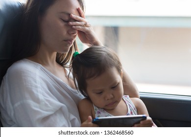 Tired Stressed Mother Taking A Nap With Her Child.