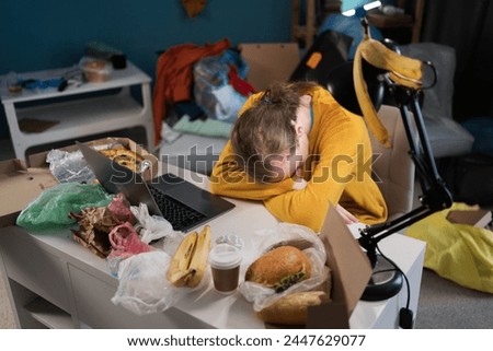 Tired student sleeping while preparing for exams in dirty, messy room. Copy space