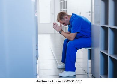 A Tired Surgeon Is Sitting In The Hospital Locker Room After Surgery. Difficult Work Shift.