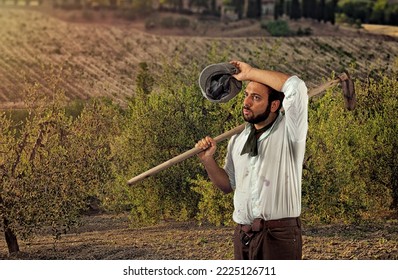 Tired and sweaty farmer with a hoe on his shoulder. - Powered by Shutterstock